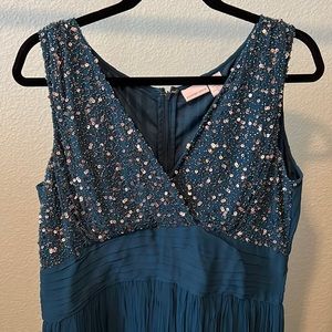 Sleeveless dress by Newport News blue and sequins in Size 14